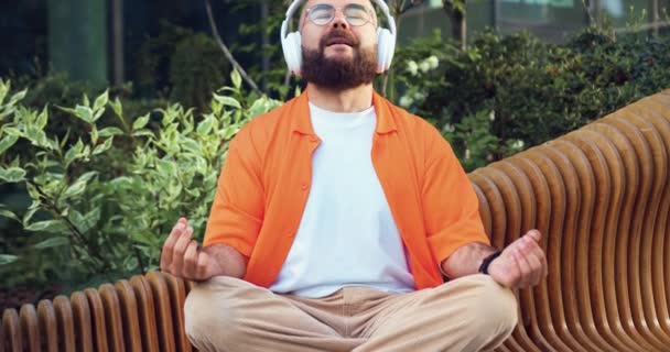 Man Wearing Headphones Using Smartphone Listing Music Enjoying Sitting Bench — Stock Video
