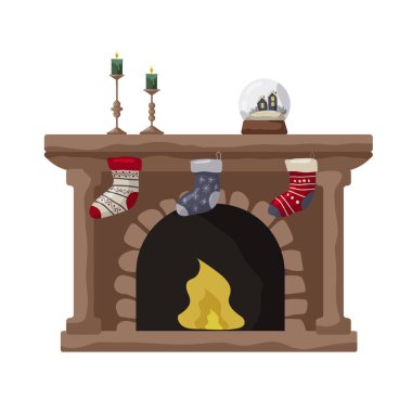 Taş yapısı olan sıcak bir şöminede mantodan sarkan renkli çoraplar var..