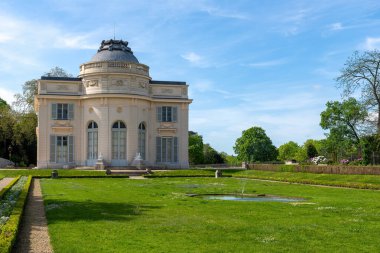 Bagatelle castle in the Bagatelle park at springtime. This small castle was built in 1777 in Neoclassical-style. Located in Boulogne-Billancourt near Paris, France clipart