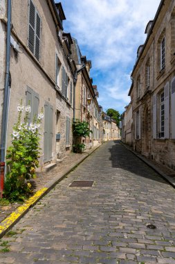 Typical Old cobbled street in the medieval city center of Senlis in Oise, Picardy, France