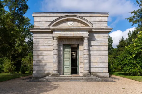 Stock image Rambouillet, France - August 15 2024: Entrance to Queen's Dairy in the domain of Rambouillet. This Dairy was a gift from Louis XVI to Marie-Antoinette in 1787.