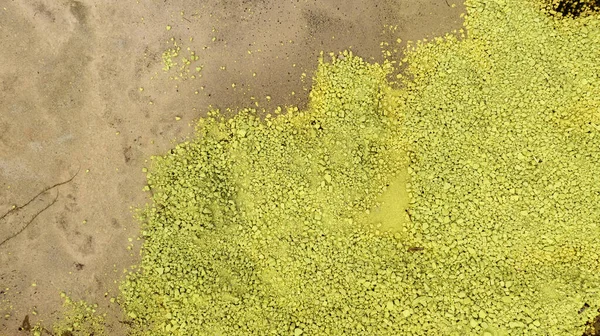 Chemical toxic waste from factory industry. Yellow sulphur powder. Hazardous waste. Acid toxic waste in factory concept. Toxic waste pollution. Soil contamination or soil pollution. Environment issue.