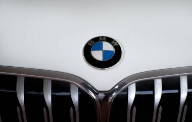 KHON KAEN, THAILAND-DECEMBER 18, 2022: Closeup BMW car with company logo. Luxury car brand. BMW is an abbreviation for Bayerische Motoren Werke. The circular blue and white BMW logo on white BMW car.