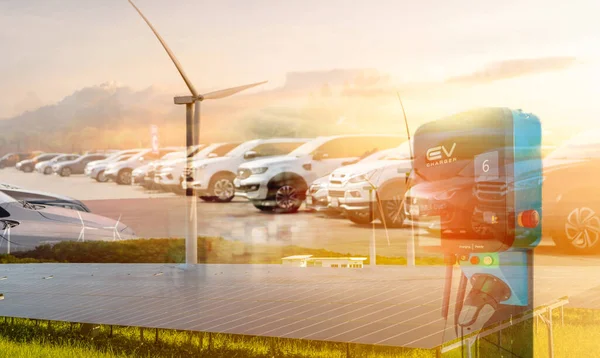 Sustainable energy for electric vehicle. EV car with electric vihicle charging station. Solar and wind turbine farm. Renewable, sustainable energy. Green energy. Solar, wind power. Sustainability.