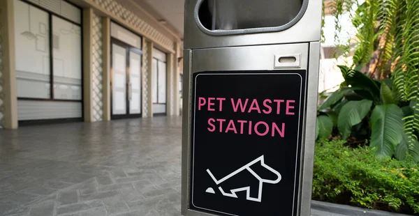 Pet waste station. Pet waste cleanup. Bin for dog owner cleanup dog excrement. Dog poop container. Hygienic pet poop solution. Outdoor public waste station. Community pet waste station.
