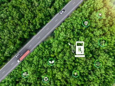 Yeşil hidrojen. Sürdürülebilir yenilenebilir enerji. Hidrojen yakıtlı hücre aracı. Sıfır emisyon arabası. Gelecek enerjisi. Yeşil teknoloji. Yeşil hidrojen enerji üretimi için güneş ve rüzgar enerjisi. Hidrojen ekonomisi.