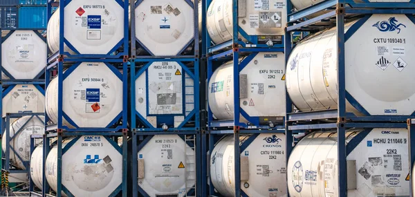 Stock image SAMUT PRAKAN, THAILAND-APRIL 16, 2023: Chemical tank container. ISO tank container for chemical delivery. Bulk liquid transport. Chemical company. Container freight area. Global logistics business.