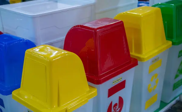 Trash can supplier. Plastic recycling bins for Eco-friendly waste management. Blue, red, yellow, and green bins for sustainable disposal. Plastic trash can distributor. Container for sorting waste.