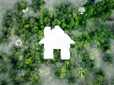 Yenilenebilir enerji kaynakları olan sürdürülebilir bir ev. Rüzgar türbinleri ve güneş panelleri enerji tasarruflu kentsel yaşam ve çevre dostu yeşil bina tasarımları için elektrik sağlıyor. Karbondioksiti azalt.