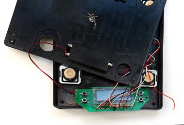 Open electronic device with visible circuit board chips and vires