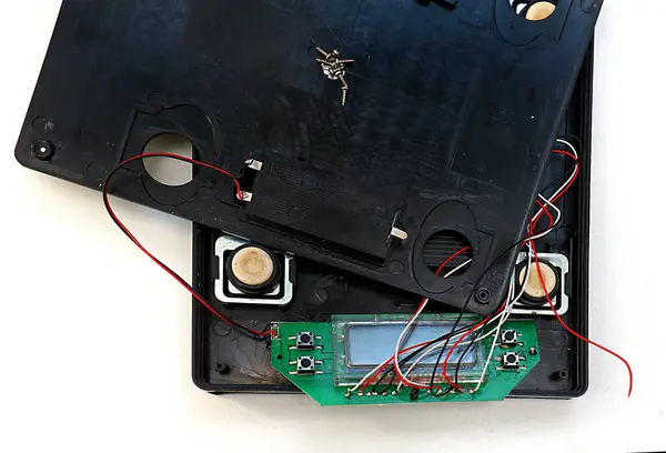 Open electronic device with visible circuit board chips and vires