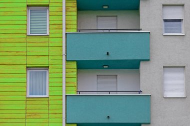 Modern building facade with closed windows and balconies exterior