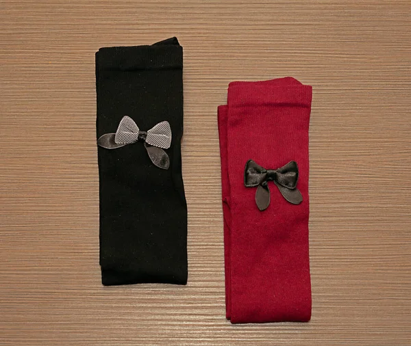 Black Red Cotton Material Socks Decorative Bows Folded Wooden Table — Stock Photo, Image