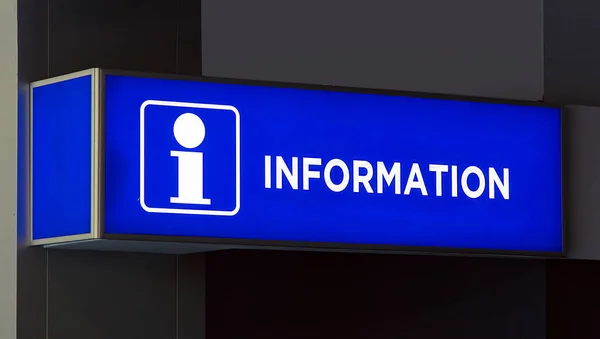 Information sign on illuminated lit up board outside