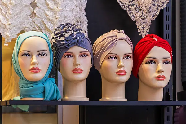 Female mannequins heads wearing traditional hijab scarves outside on a market in Istanbul