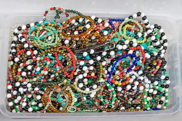 Pile of colorful art and craft homemade pearls jewelry accessories