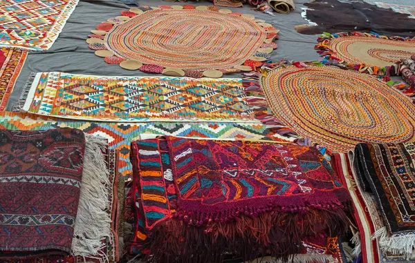 Old traditional colorful carpets on the floor sold on Istanbul bazaar