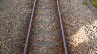 Train journey point of view from on the rear back view of train commuter car Railway Track Seen from Train Perspective POV in japan