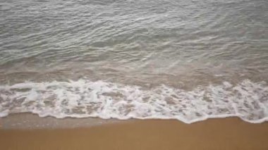 beach sea sand with ocean wave hit coast shore. Landscape view of beach sea in summer day. Beach space area.