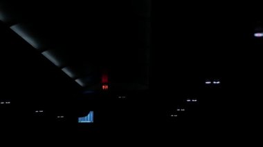 view to the exit sign for exit emergengy door while light on prepare for landing in night time, inside cabin airplane safety light up travel holiday