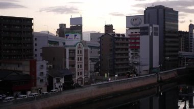 November 15,2022:Fukuoka,Japan:landscape view of the hakata habitat housing building city area with sunrise early morning sky, sunrise cityscape of Fukuoka area