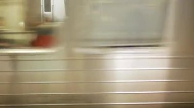 close up view to the train subway commuter while arriving to the platform of the train station in rush hour, mmotion blur background transportation