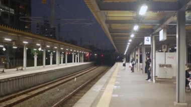 November 13,20222:Fukuoka,Japan:Many passenger waiting on the platform in subway japan station for the arriving subway commuter train in rush hour