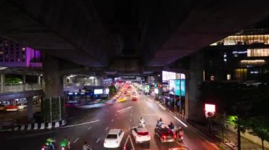 November 20,2022:Bangkok,Thailand:4k vertical time lapse long exposure traffic jam in bangkok Thailand at siam square famous shopping area.rush hour in asian megacity. Movement of cars night road.