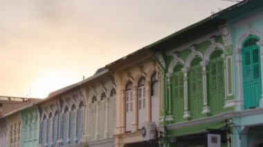 December 28,2022:Phuket old town,Thaialnd: Timelapse landscape view of colonial architecture heritage building with some traffic in sunrise morning daytime