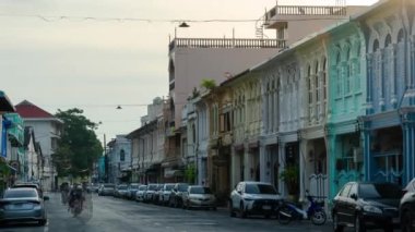 December 28,2022:Phuket old town,Thaialnd: Timelapse landscape view of colonial architecture heritage building with some traffic in sunrise morning daytime