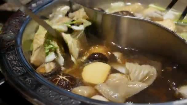 Chinese Style Spicy Hot Pot Cuisine While Cooking Mushroom Pork — Stock Video