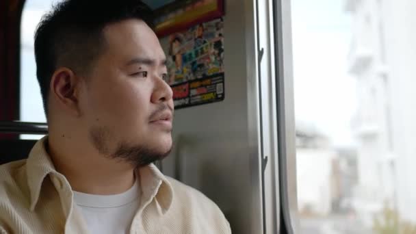 Asian Man Travel Local Train Relaxing Window While Train Moving — Stock videók