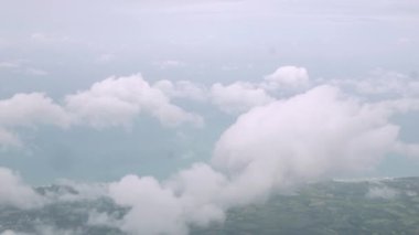 beautiful blue sky with clouds on bright sunny day for abstract background,sky with cloud from airplane window while flying in the sky