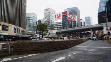 Decemer29,2023.Tokyo,Japan.street landscape view at central shopping area of Tokyo in Japan with cars traffic in winter daytime