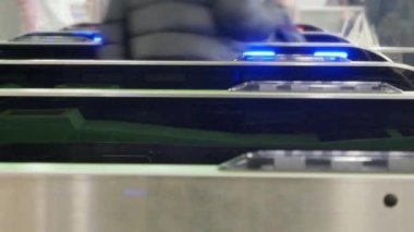 Close up view of the ticket gate in the train station with many passenger get through the ticket gate in rush hour with RFID card in metropolitant big city of Tokyo