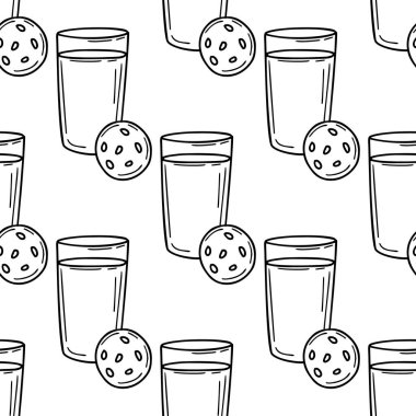 Bir bardak süt ve bisküvi eşliğinde kusursuz desenler beyaz üzerine karalama tarzıyla çizilmiş.