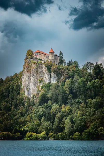 stock image Ancient castle in the mountains, captured in Slovenia on Bled lake.