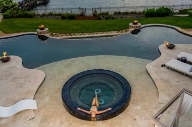 A gorgeous blonde model enjoys a day at home