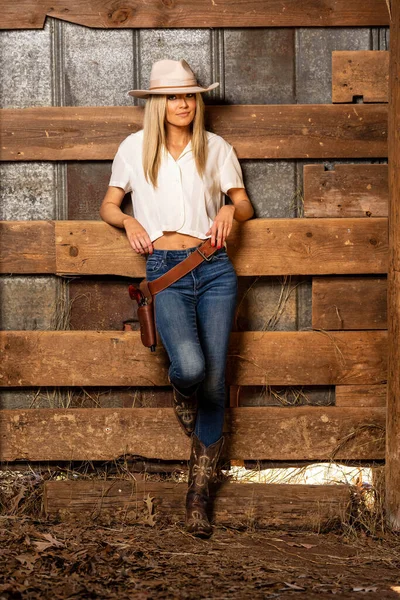 stock image A gorgeous blonde cowgirl model poses outdoors while enjoying the spring weather