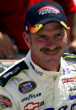 Kerry Earnhardt enjoys a few laughs with his fellow competitors before the start of the GNC Live Well 250 NASCAR Busch Grand National race at the Milwaukee Mile in West Allis, Wisconsin.