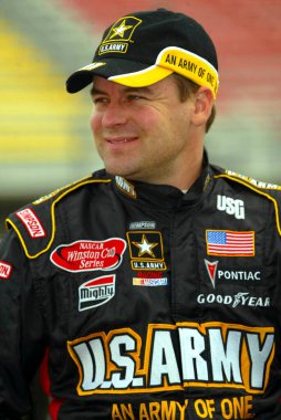 April 25, 2003 - Fontana, CA, : Jerry Nadeau takes a moment to smile before qualifying at the California Speedway for the running of the Auto Club 500 NASCAR Winston Cup race in Fontana, California.
