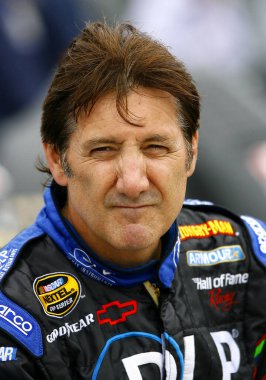 August 10, 2007 - Watkins Glen, NY, USA: Ron Fellows sits on the wall along pit road as he waits for the mist to subside at Watkins Glen.