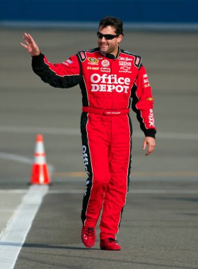 09 October, 2009:   Tony Stewart waves to the fans before qualifying for the Pepsi 500 race at the Auto Club Speedway in Fontana, CA.