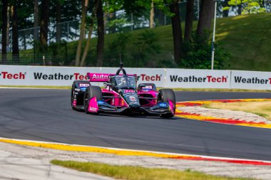 Brezilya, Sao Paulo 'dan HELIO CASTRONEVES (06), Elkhart Lake WI' deki Road America 'da yapılan Sonsio Grand Prix tatbikatı sırasında virajlardan geçer..