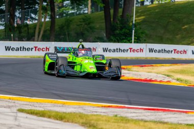 Hedensted, Danimarka 'dan Christian LUNGAARD (45), Elkhart Lake WI. Dünya Savaşı' ndaki Road America 'da yapılan Sonsio Grand Prix tatbikatı sırasında virajlardan geçer..