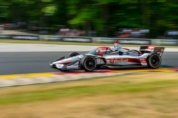 stock image STING RAY ROBB (R) (51) of Payette, Idaho travels through the turns during a practice for the Sonsio Grand Prix at Road America in Elkhart Lake WI.