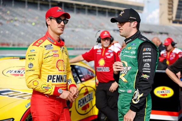 stock image NASCAR Cup Drivers, Austin Cindric (2) and Joey Logano (22) chat before qualifying for the Quaker State 400 Available at Walmart at the Atlanta Motor Speedway in Hampton GA.