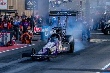 NHRA driver, Buddy Hull, prepares to qualify for the Dodge Power Brokers NHRA Mile-High Nationals in Morrison, CO, USA.  