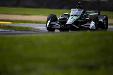 Arrecifes, Arrecifes 'in AGUSTIN HUGO CANAPINO (R) (78), Arjantin Lexington OH' daki Orta Ohio Spor Otomobil Sahası 'nda Honda Indy 200 antrenmanı sırasında yolda ilerliyor..