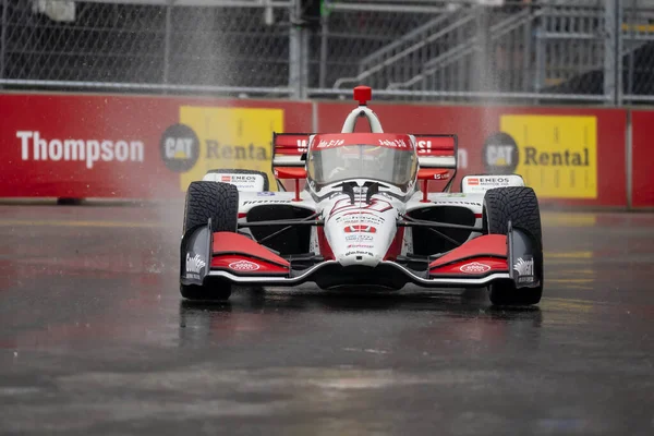 stock image INDYCAR Series driver, STING RAY ROBB (R) (51) of Payette, Idaho, travels through the turns during a wet and dangerous practice session for the Big Machine Music City Grand Prix at Streets of Nashville in Nashville TN.